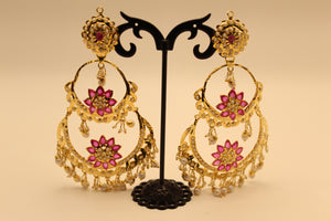 Two-tier gold chandbali earrings with pink lotus stone clusters and pearl fringe