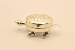 Polished silver turtle haldi kumkum container with hinged shell lid and two inner compartments