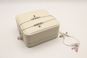 Pair of fine silver anklets with bead stations, pink crystal drops and ghungroo charms