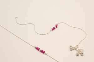 Pair of fine silver anklets with trios of ruby-pink crystal beads and textured ball charms
